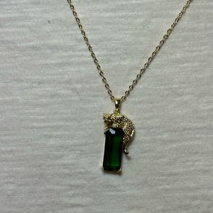 Green and gold necklace with cheetah/leopard